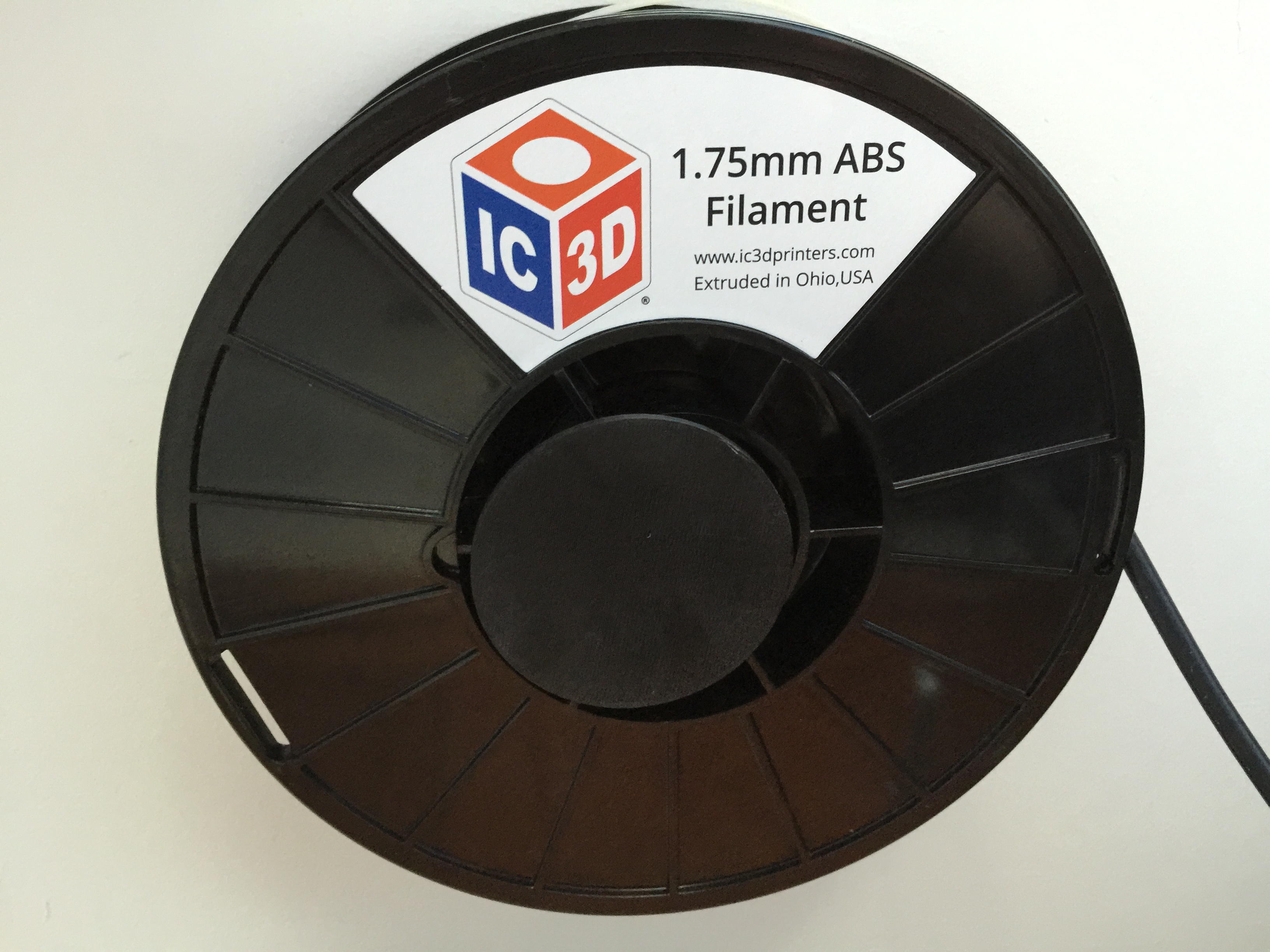 Friction locking spool wall mount