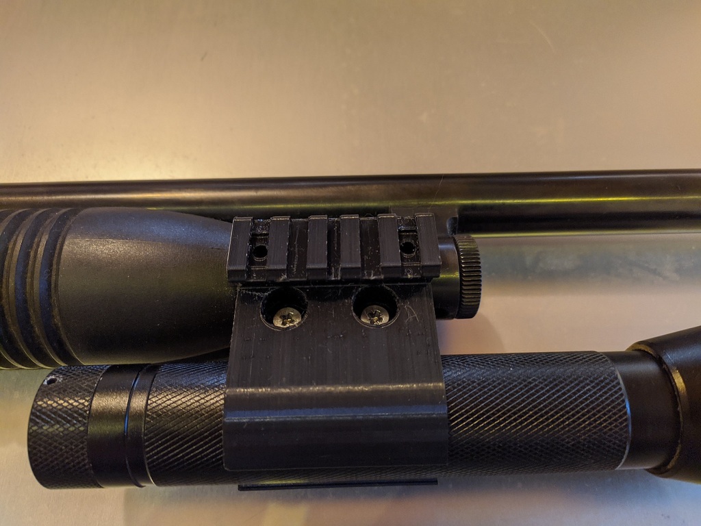Maverick 88 flashlight mount with picatinny rails
