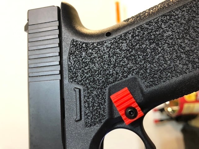 Glock extended mag release
