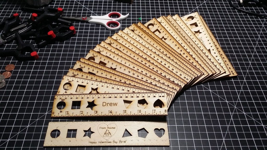 8" laser cut ruler with cutouts.
