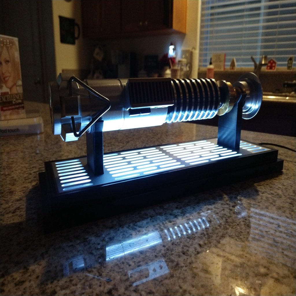 remix of "simple printable lightsaber stand" fit Disneyland Luke Skywalker Saber