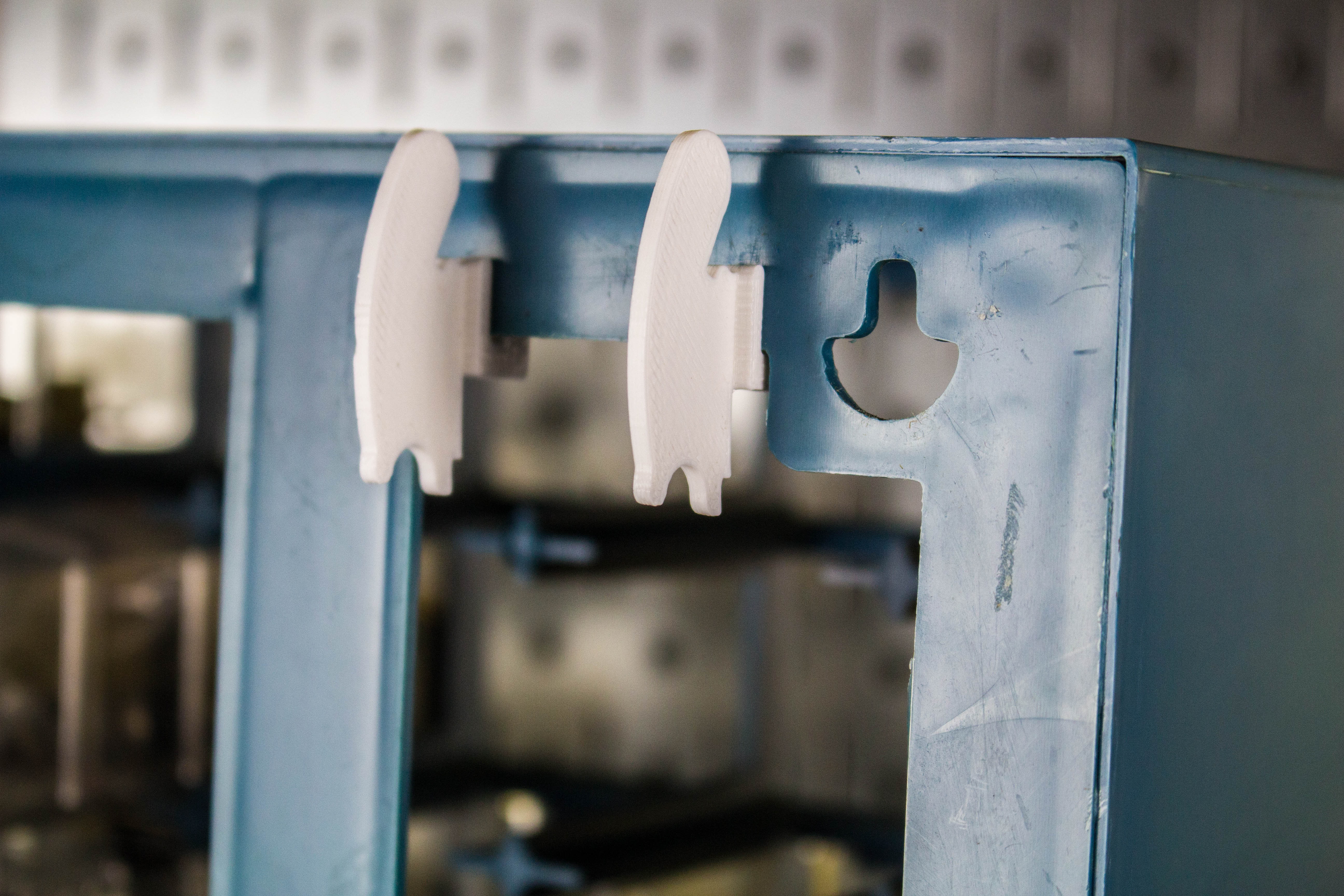Clips for Hanging Storage Cabinets on Wall Control Slotted Metal Pegboards