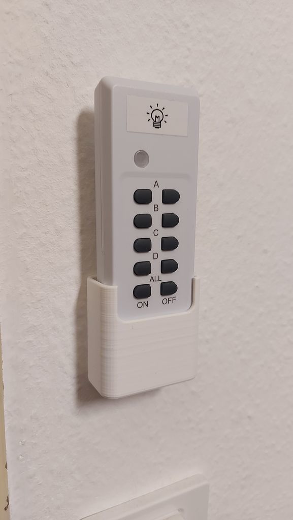 Parametric wall holder for remote control