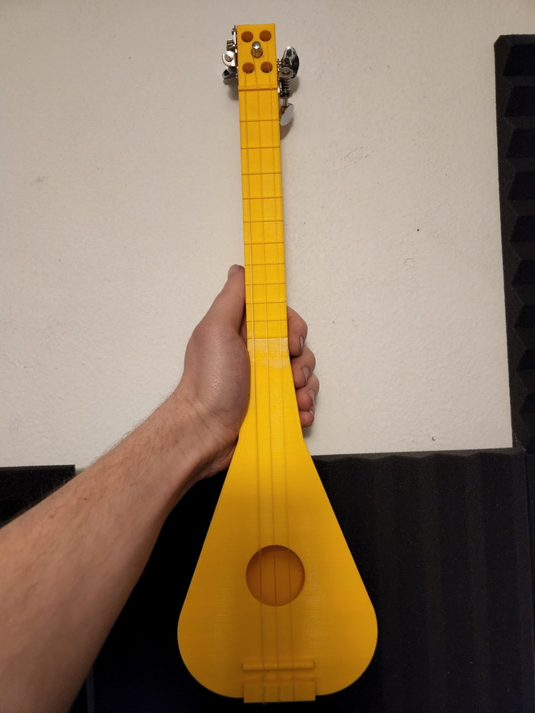 3 string ukulele-like instrument