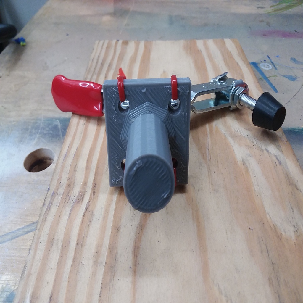Toggle clamp to bench dog hold