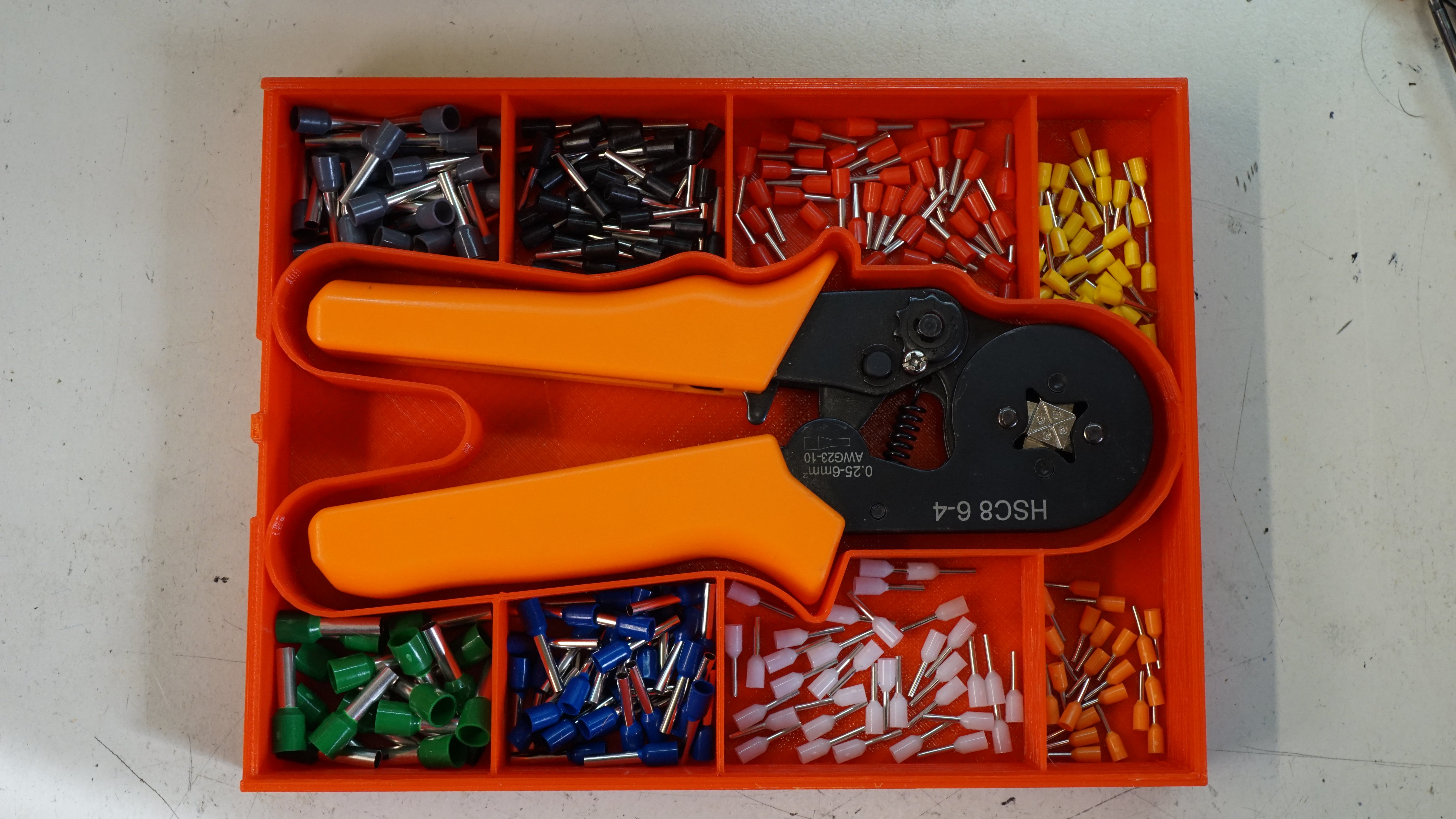 Box for crimping tool and pins