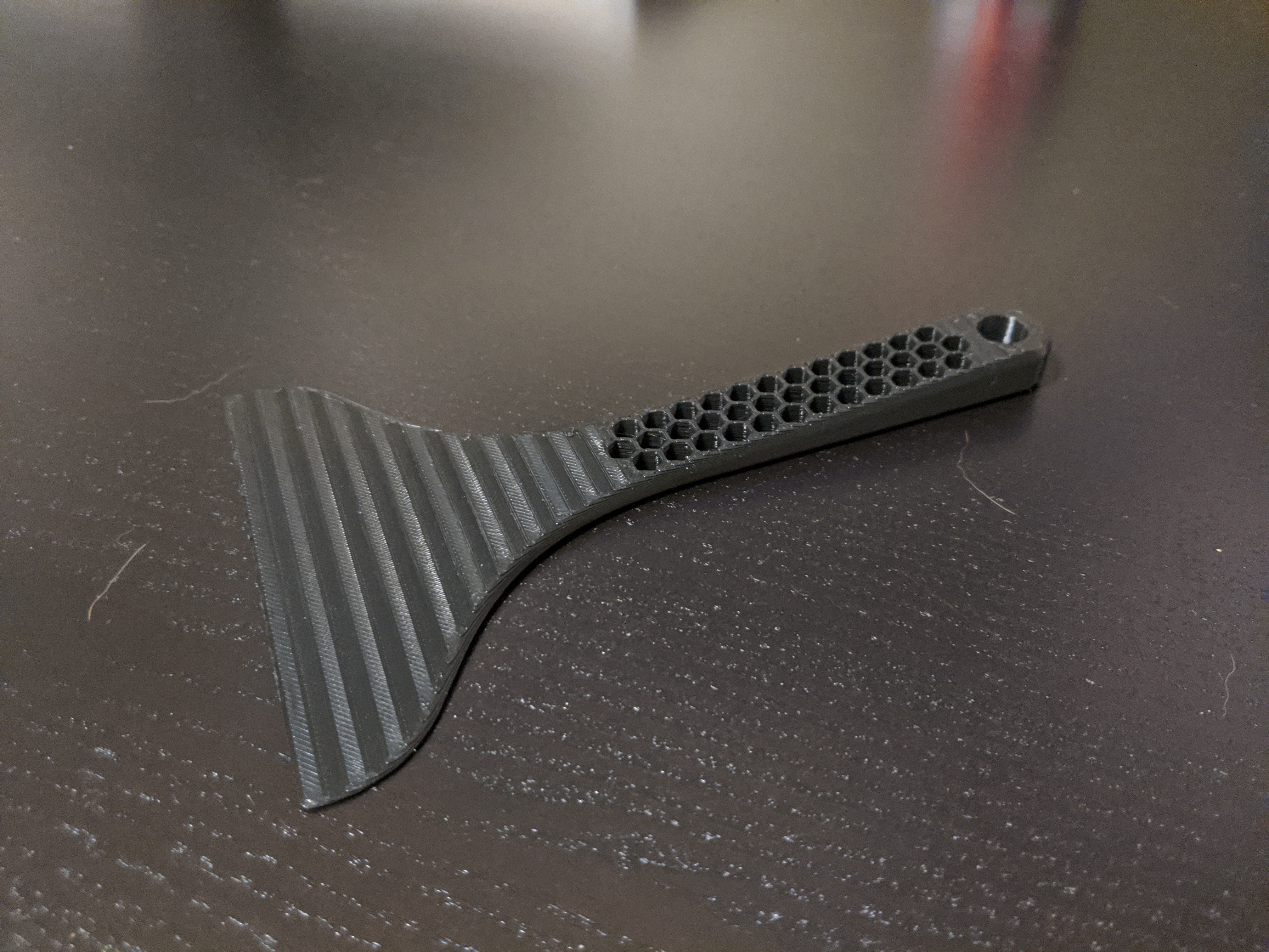 Scraper for skirts and purge lines