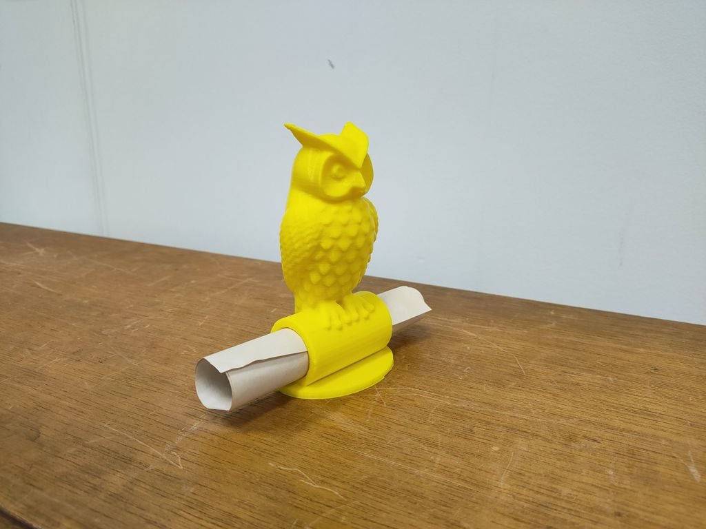 Owl Statue facing front with document tube
