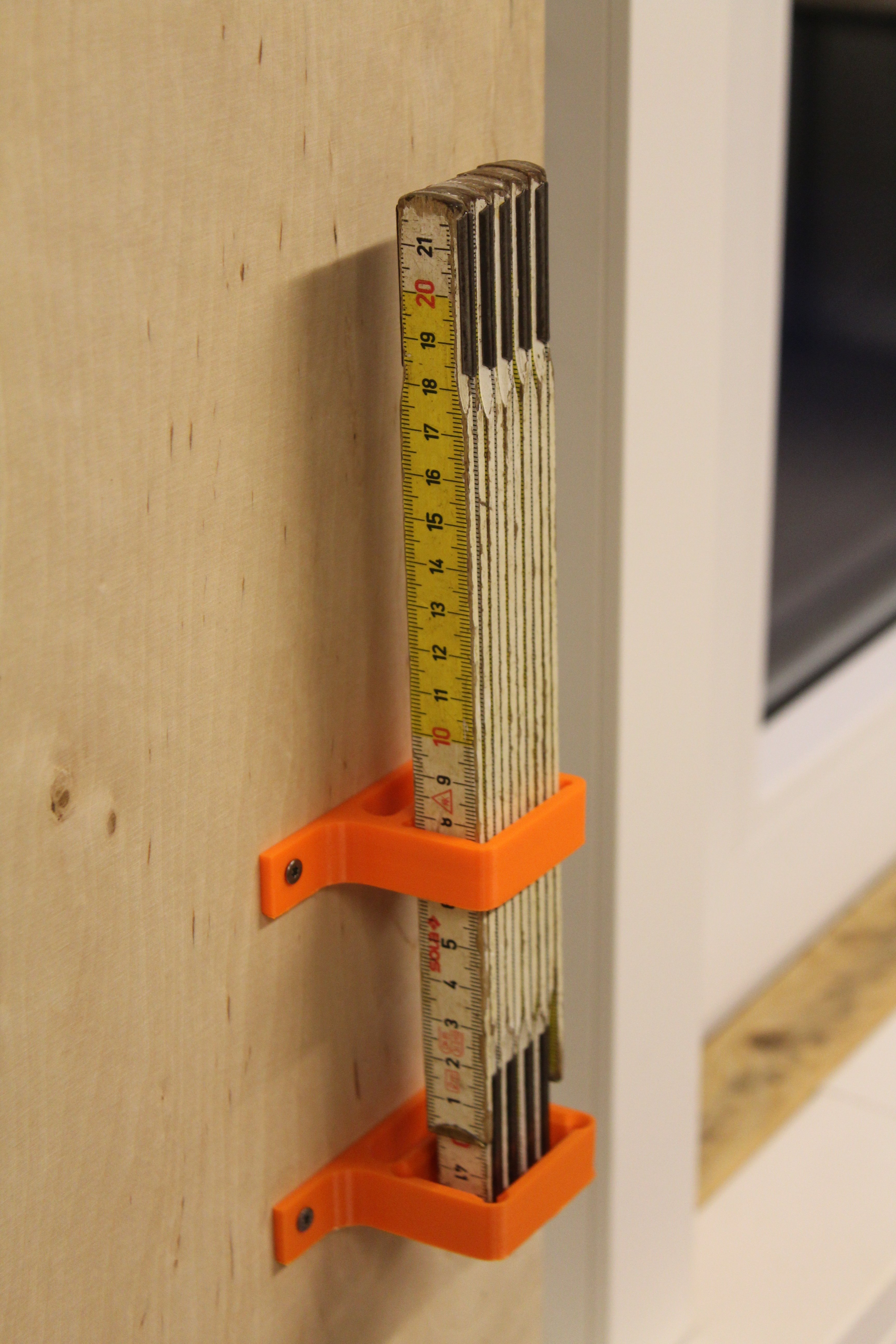 folding rule wall mount