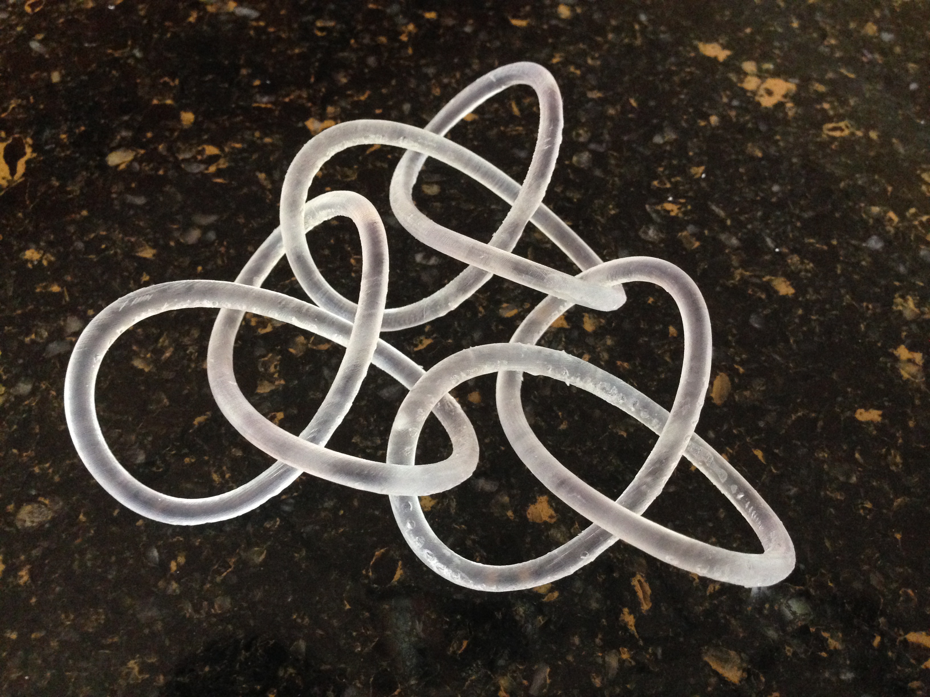Three Interlocking Trefoil Knots