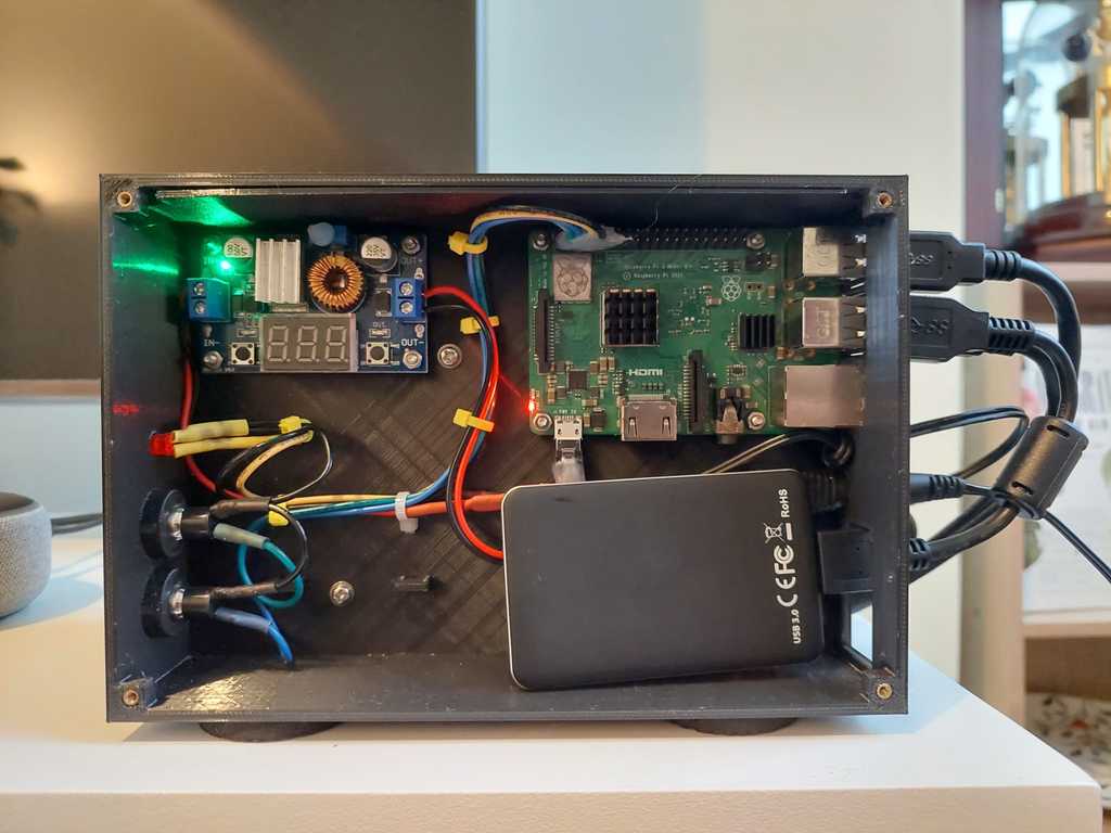 Raspberry Pi case with buck converter and pass through power for 3.5' external