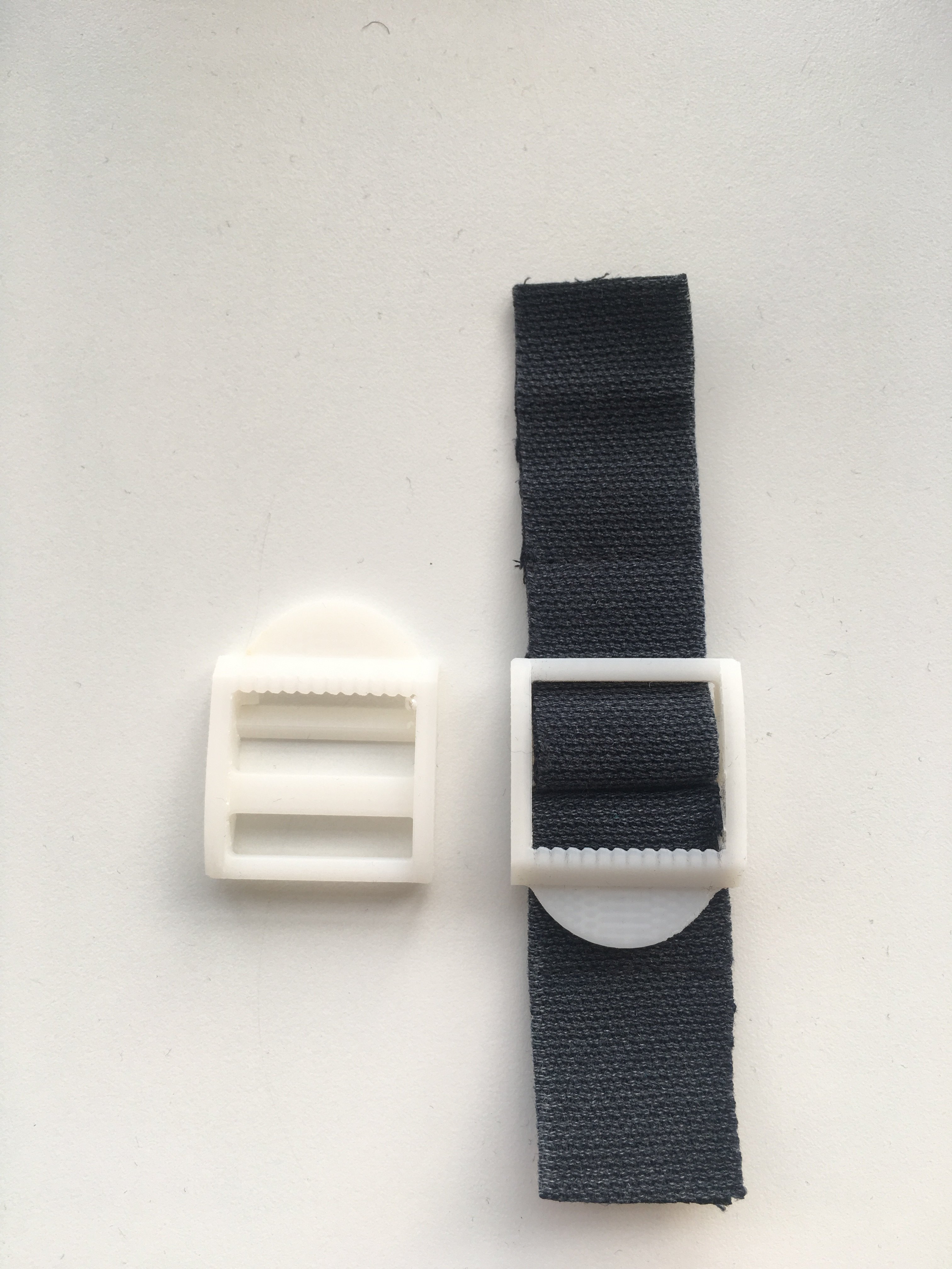 Backpack strap adjustors
