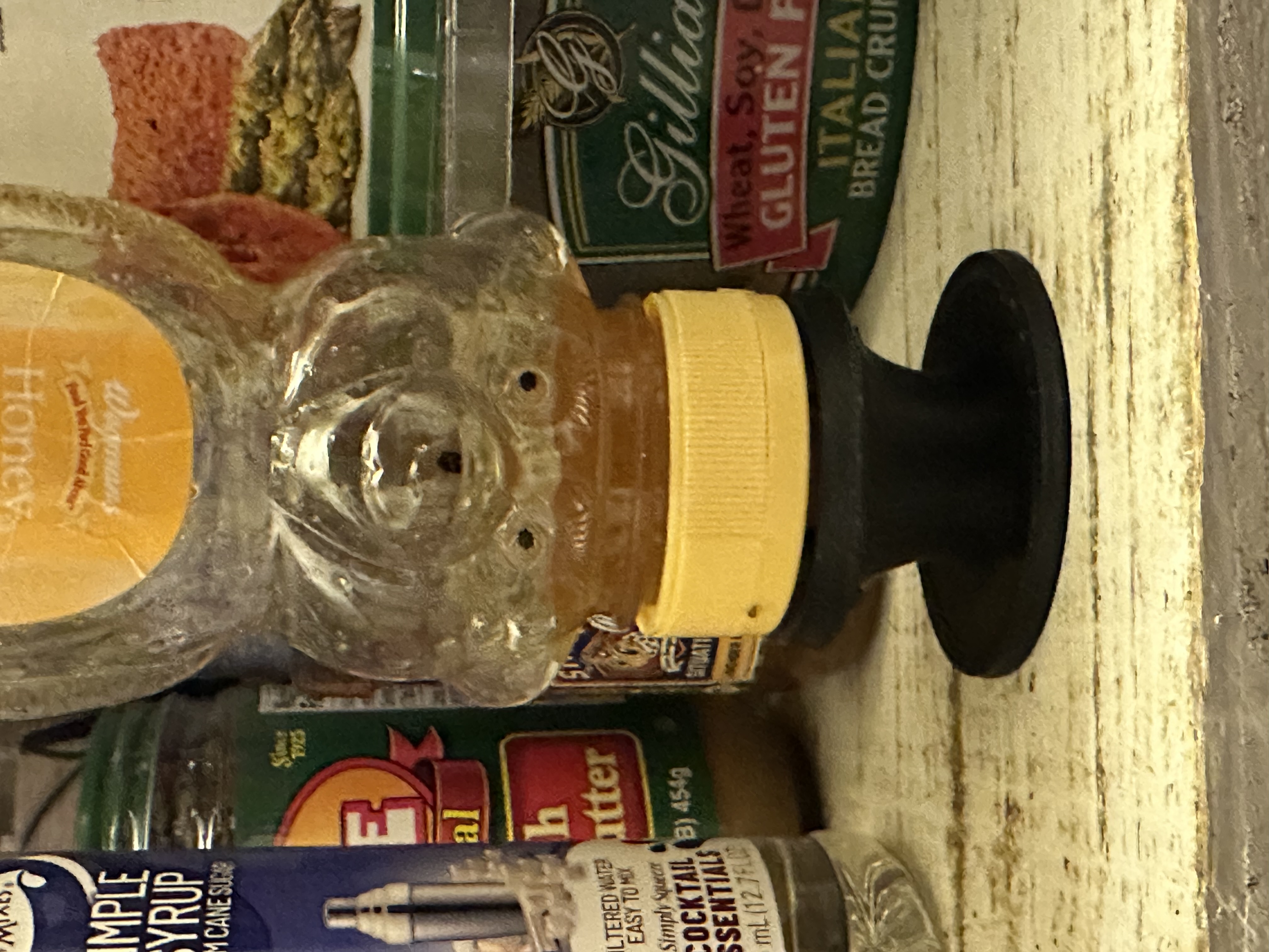 Upside down honey bear bottle holder