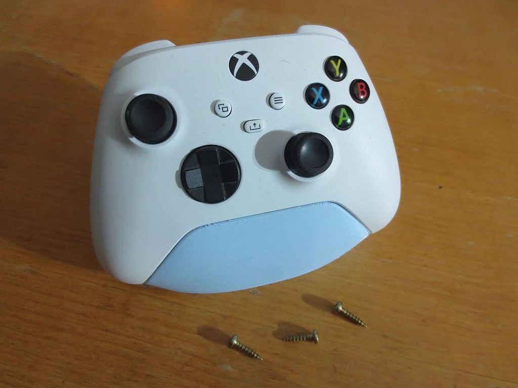 XBox stand with mounting holes.