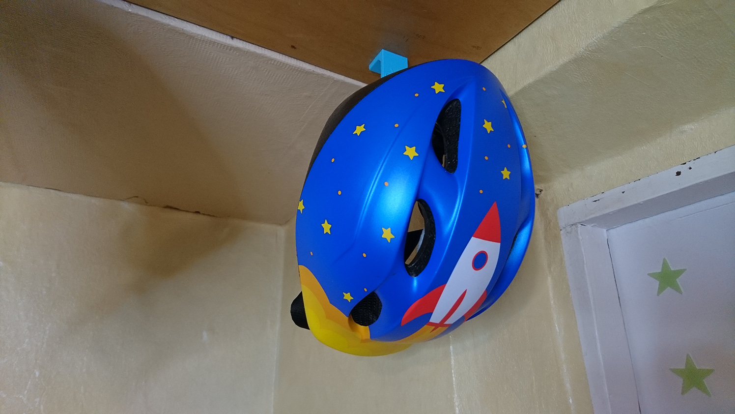 Bicycle helmet holder hook
