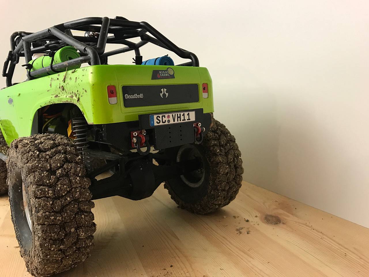 Deadbolt rear bumper and sign plate