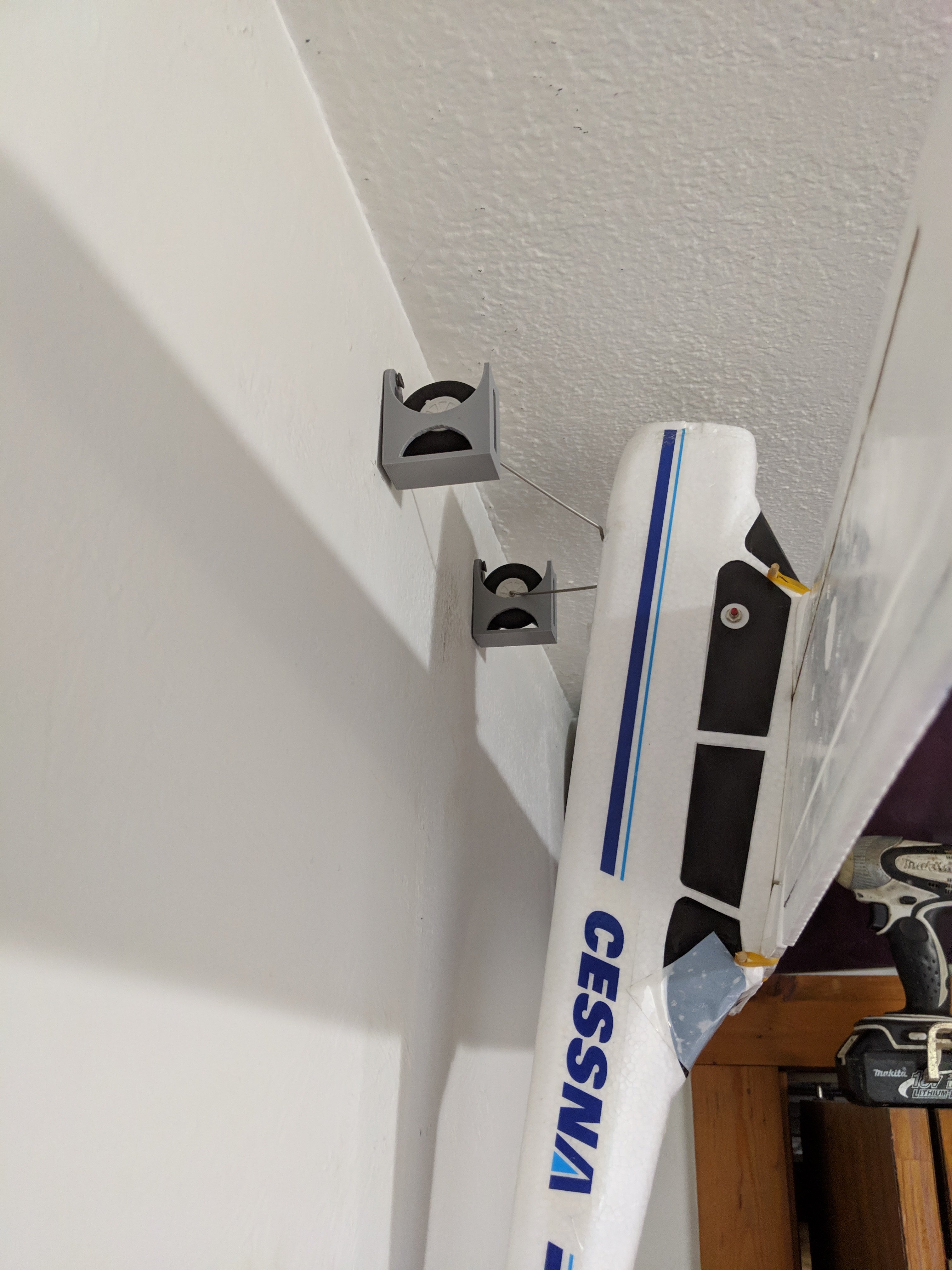 RC Plane wheel wall hanger mount