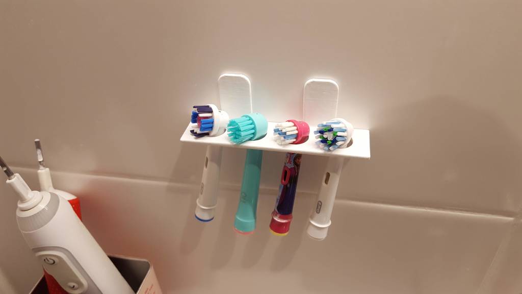 Electric toothbrush head holder