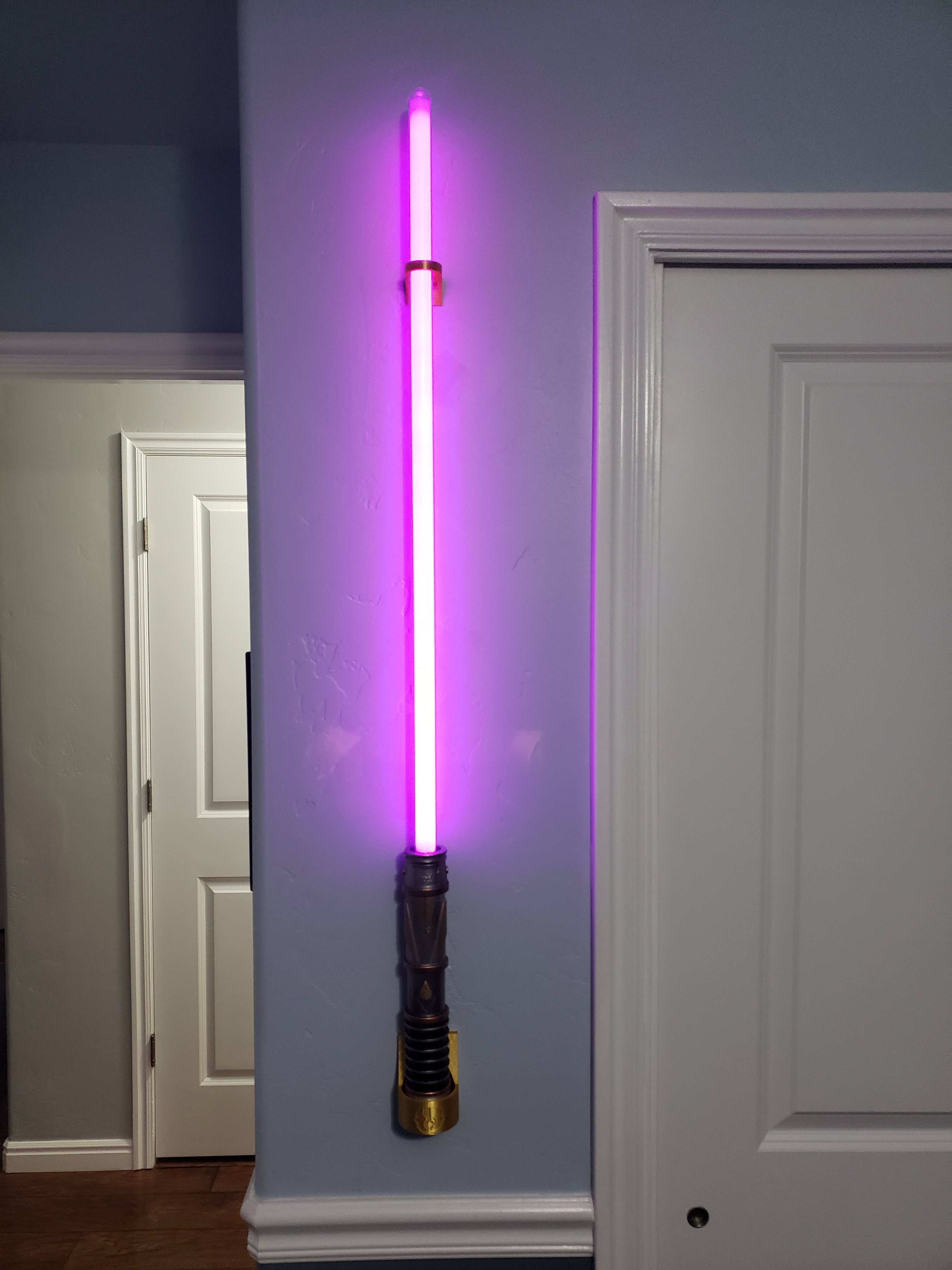 Savi's workshop lightsaber wall mount