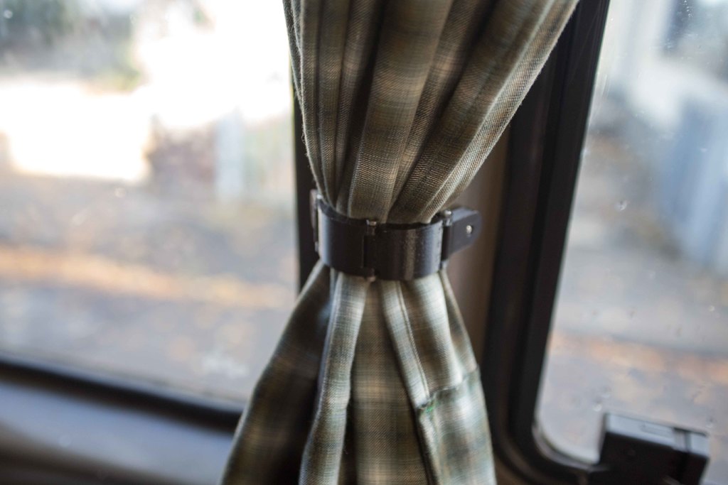 Magnetic clamp for curtains in camper van