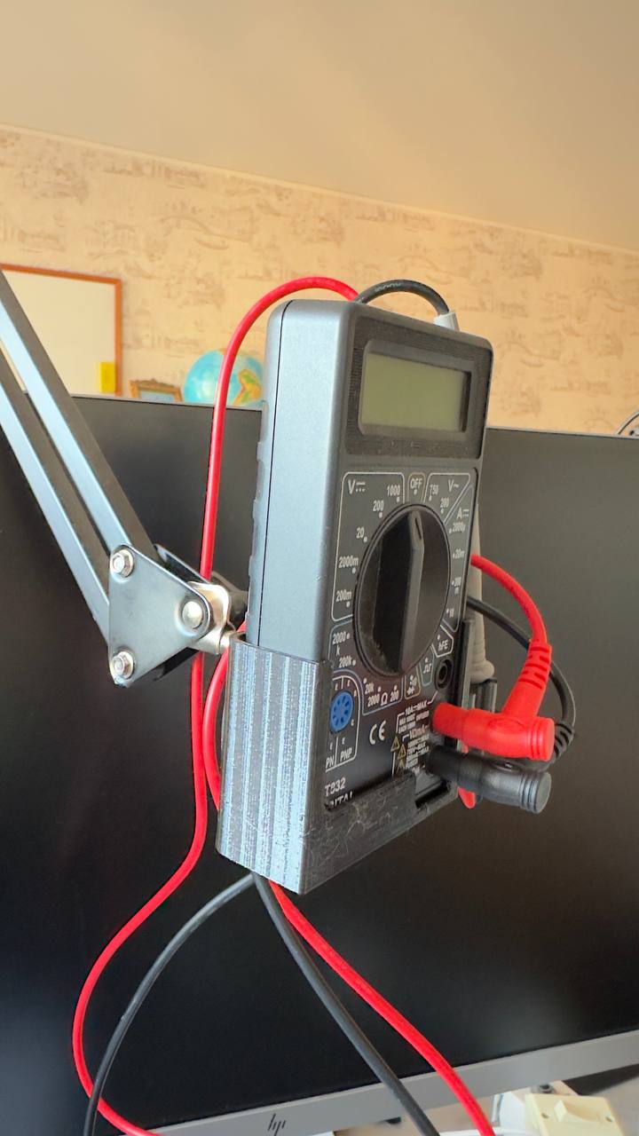multimeter holder with a pantograph mount
