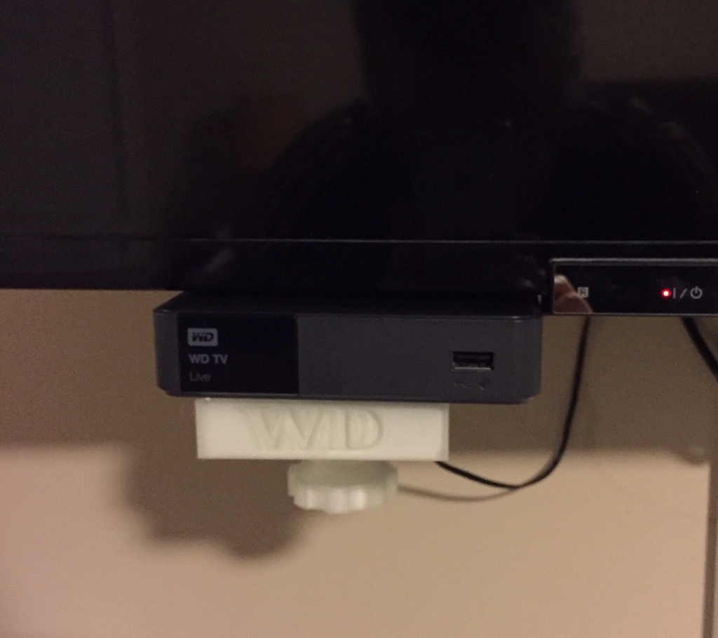 Media player clamp for TV mounting