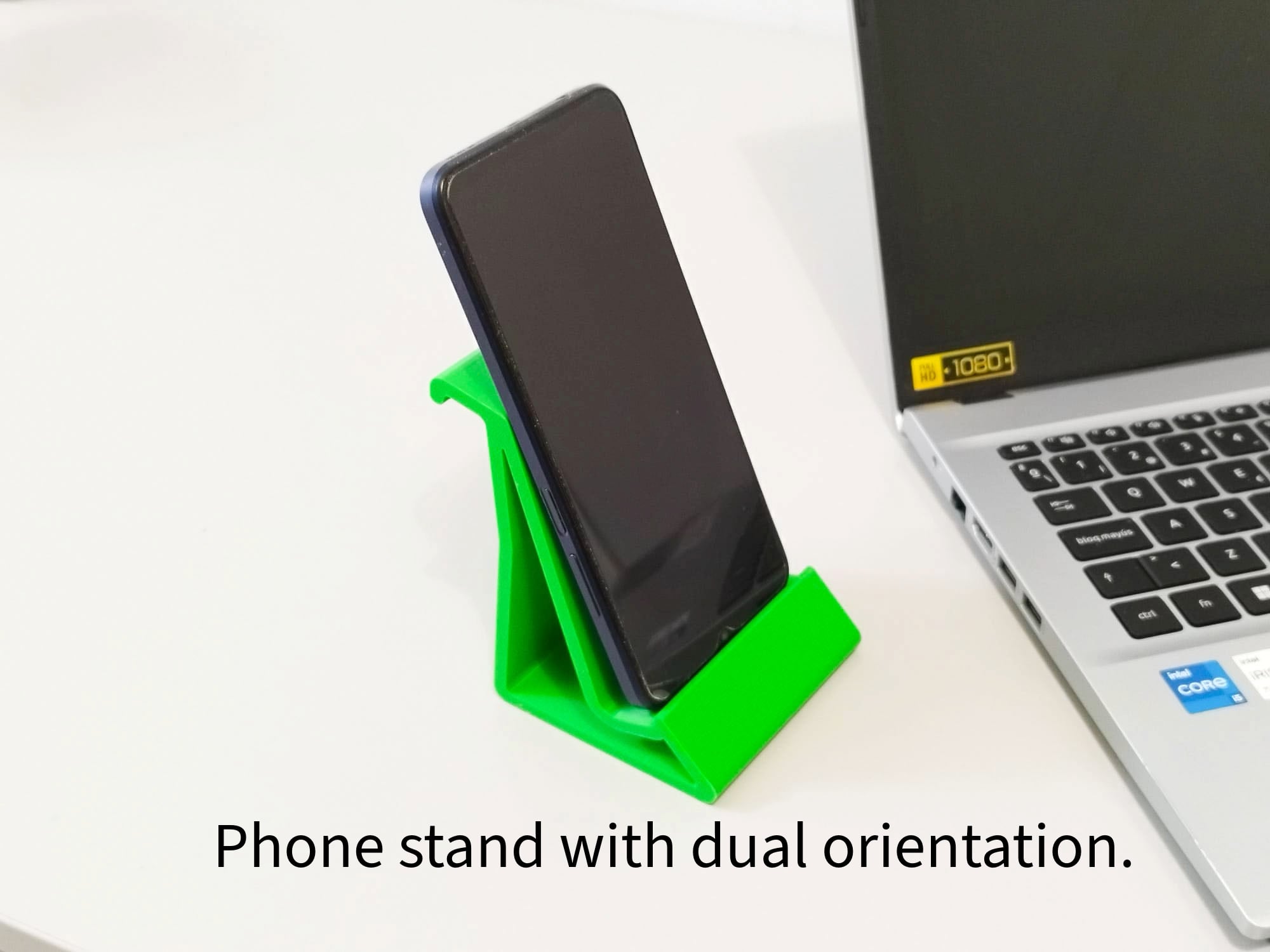 Phone holder in vertical and horizontal orientations