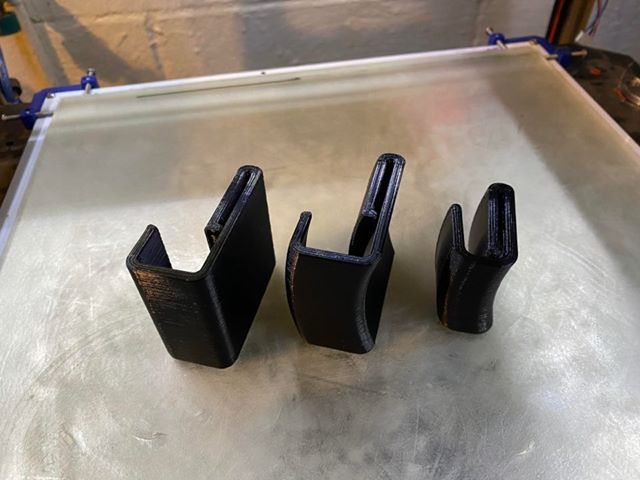 Backpack sling hook keeper