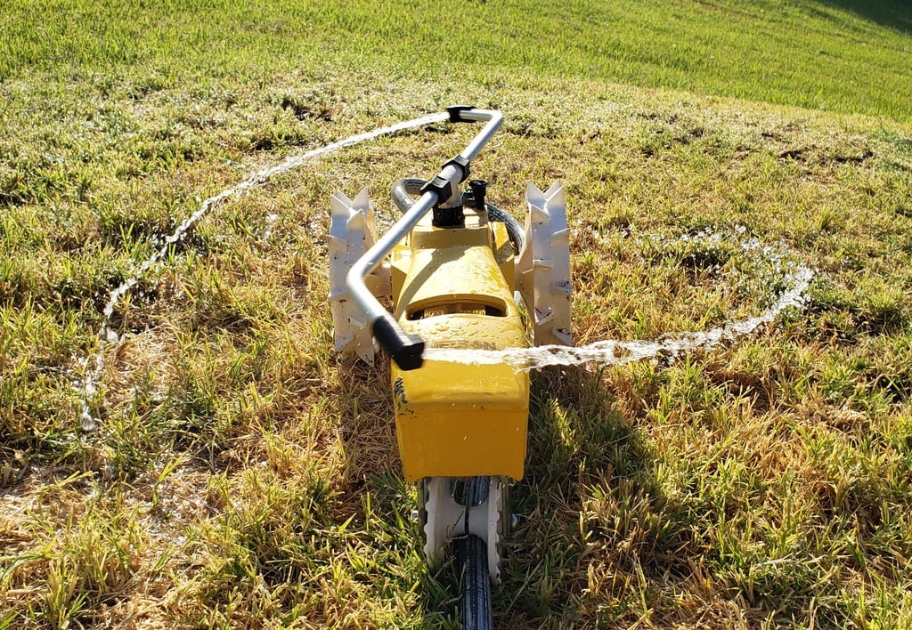 Yard sprinkler tractor deflector