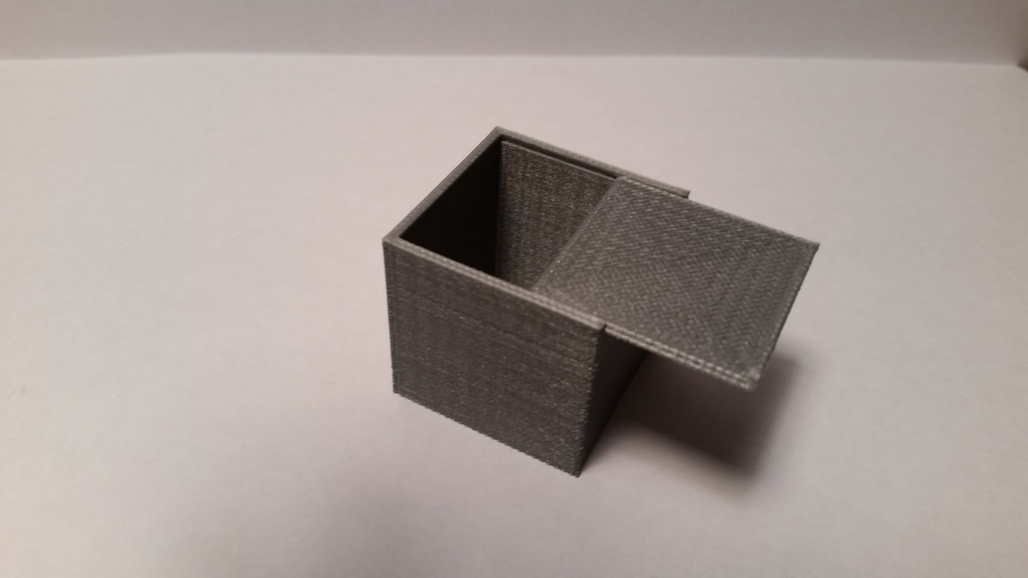 Box with sliding lid