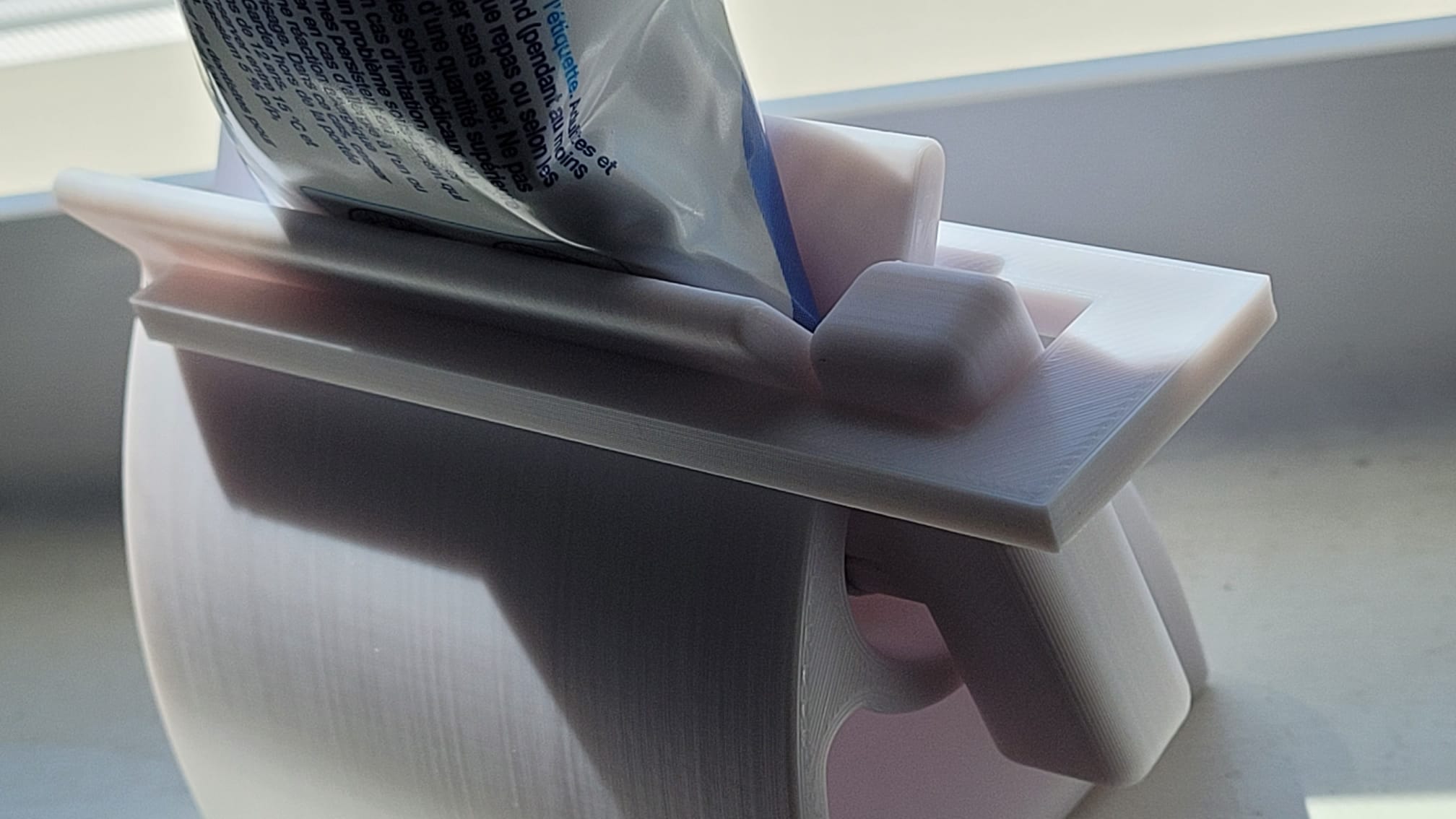 Tooth paste stand lever holder