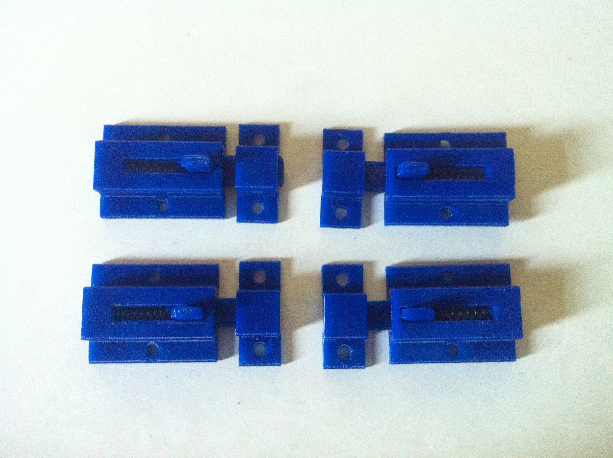 Mini spring loaded sliding latch