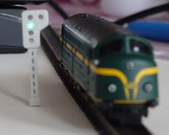 Model train signal and control with optical fiber