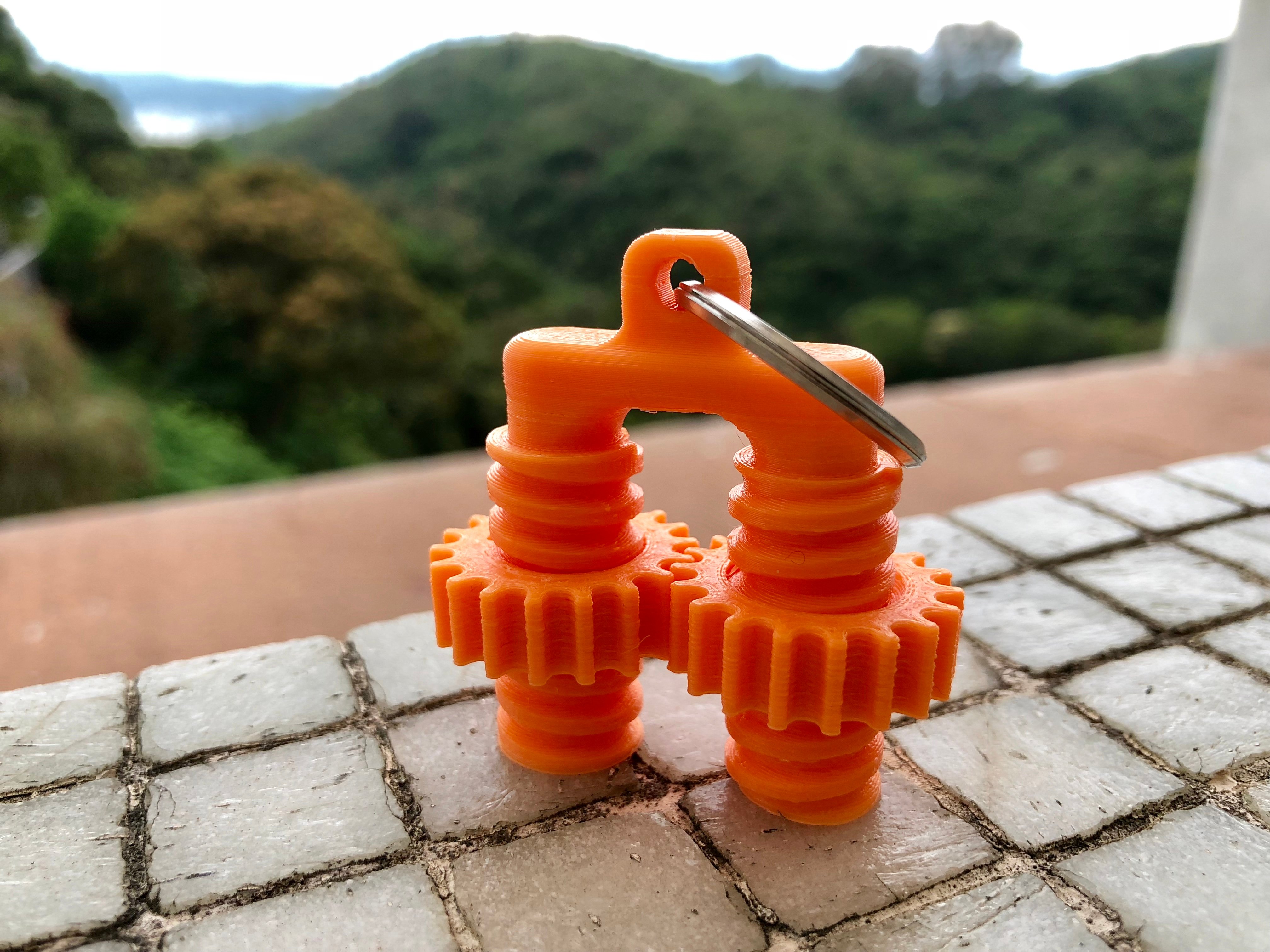 Keychain geared fidget bolt
