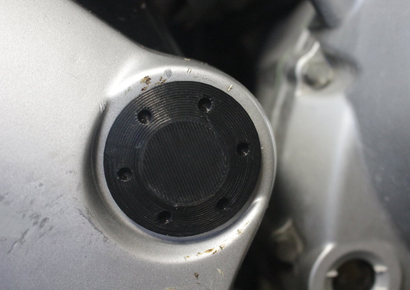 Swingarm plug for Honda Varadero 125