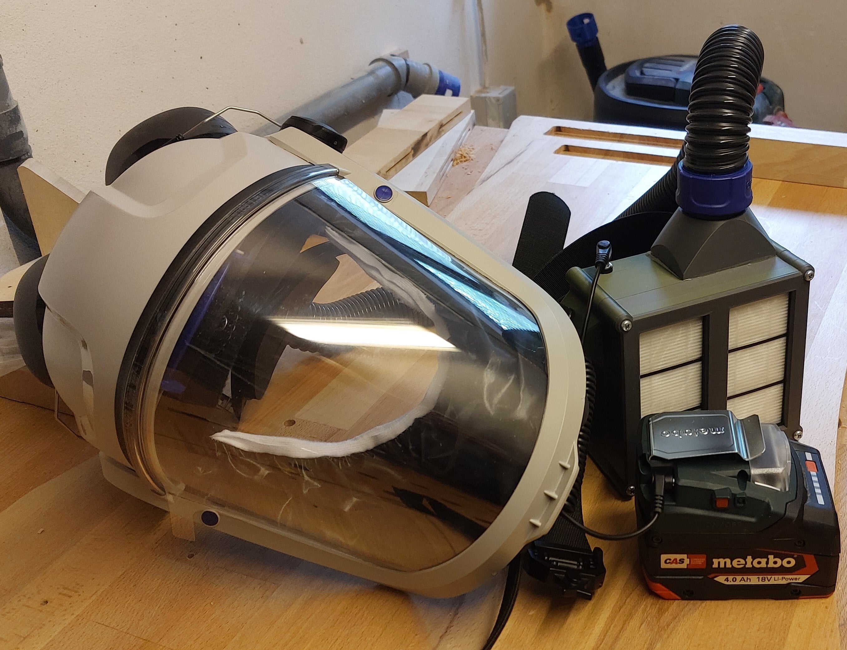 Powered Air Purifying Respirator (PAPR) with hearing protection