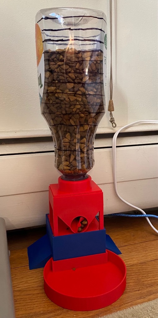 Cat feeder with Tropicana bottle hopper
