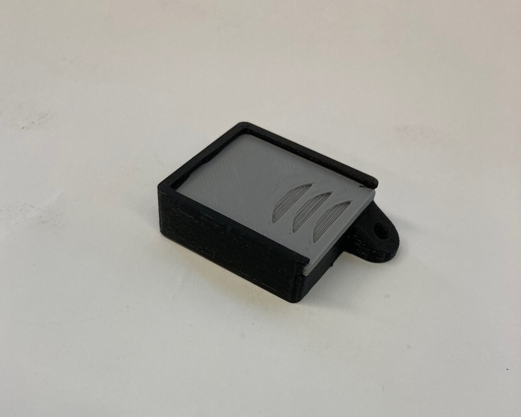 Keychain medicine box with slide top lid
