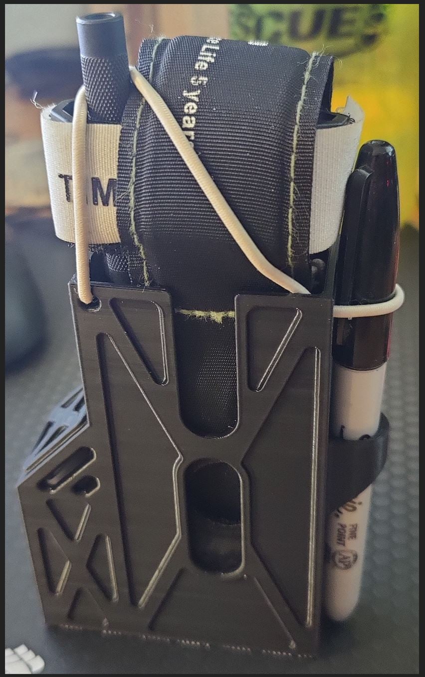 Tourniquet holster with glove pocket
