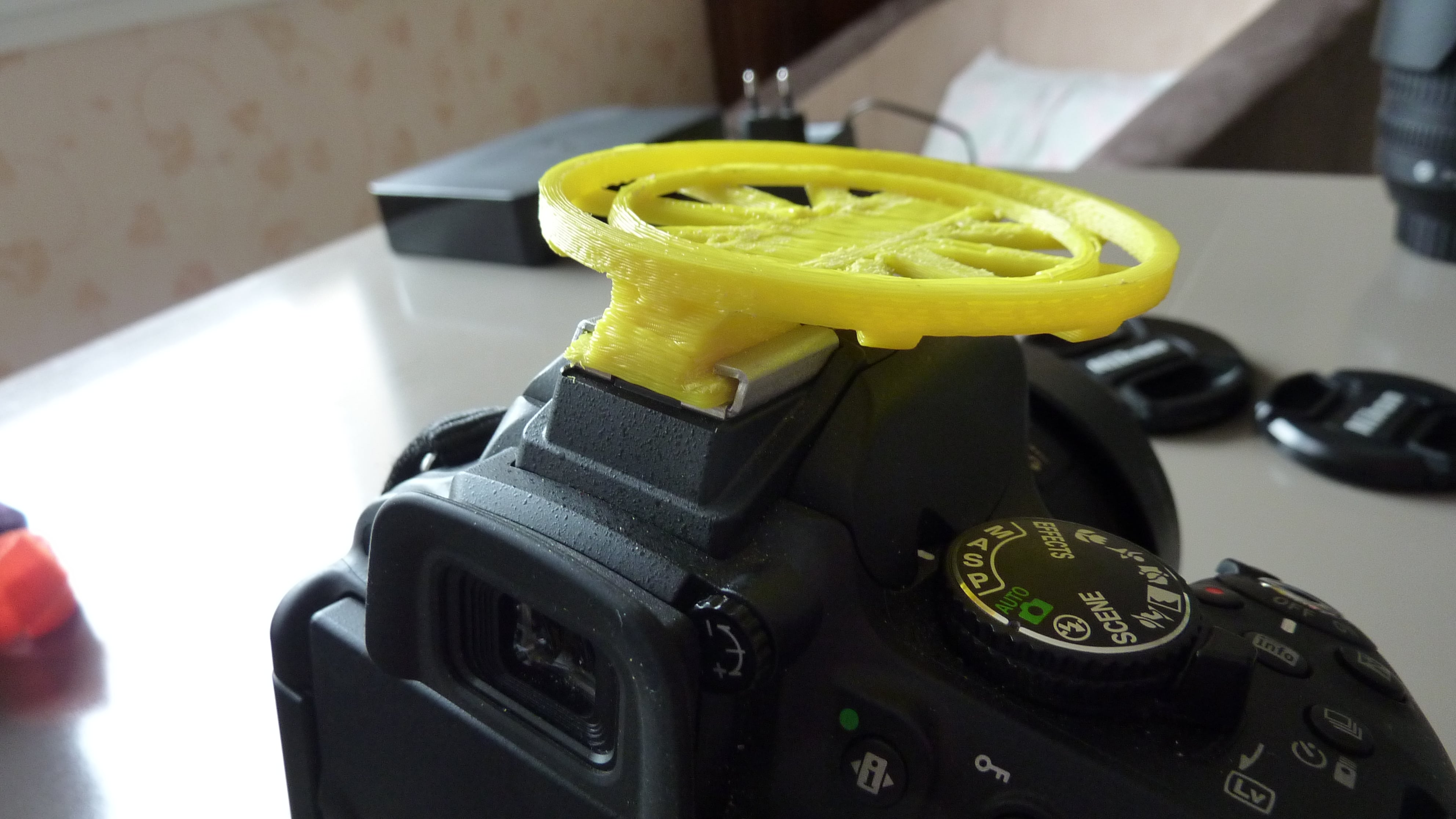Dual Lens Cap Holder on flash support 52mm and 67mm Nikon