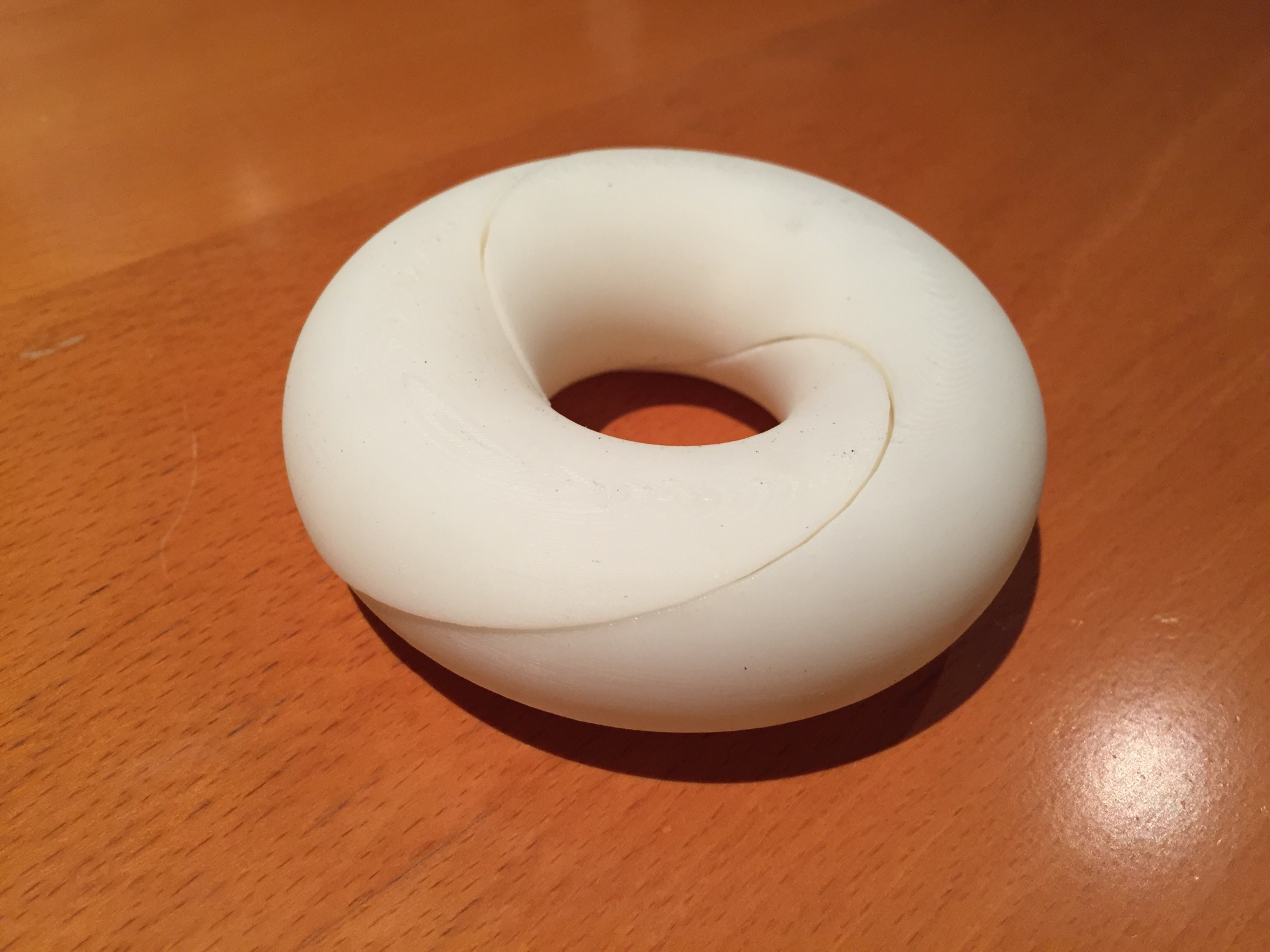 Cutting a torus with a rotating knife