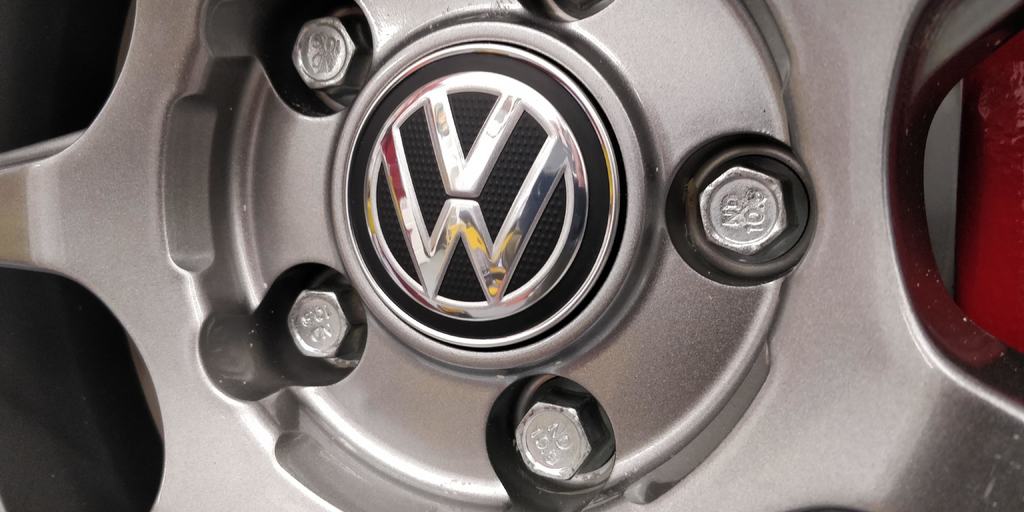 Center-cap adapter to fit OEM VW caps on Enkei wheels