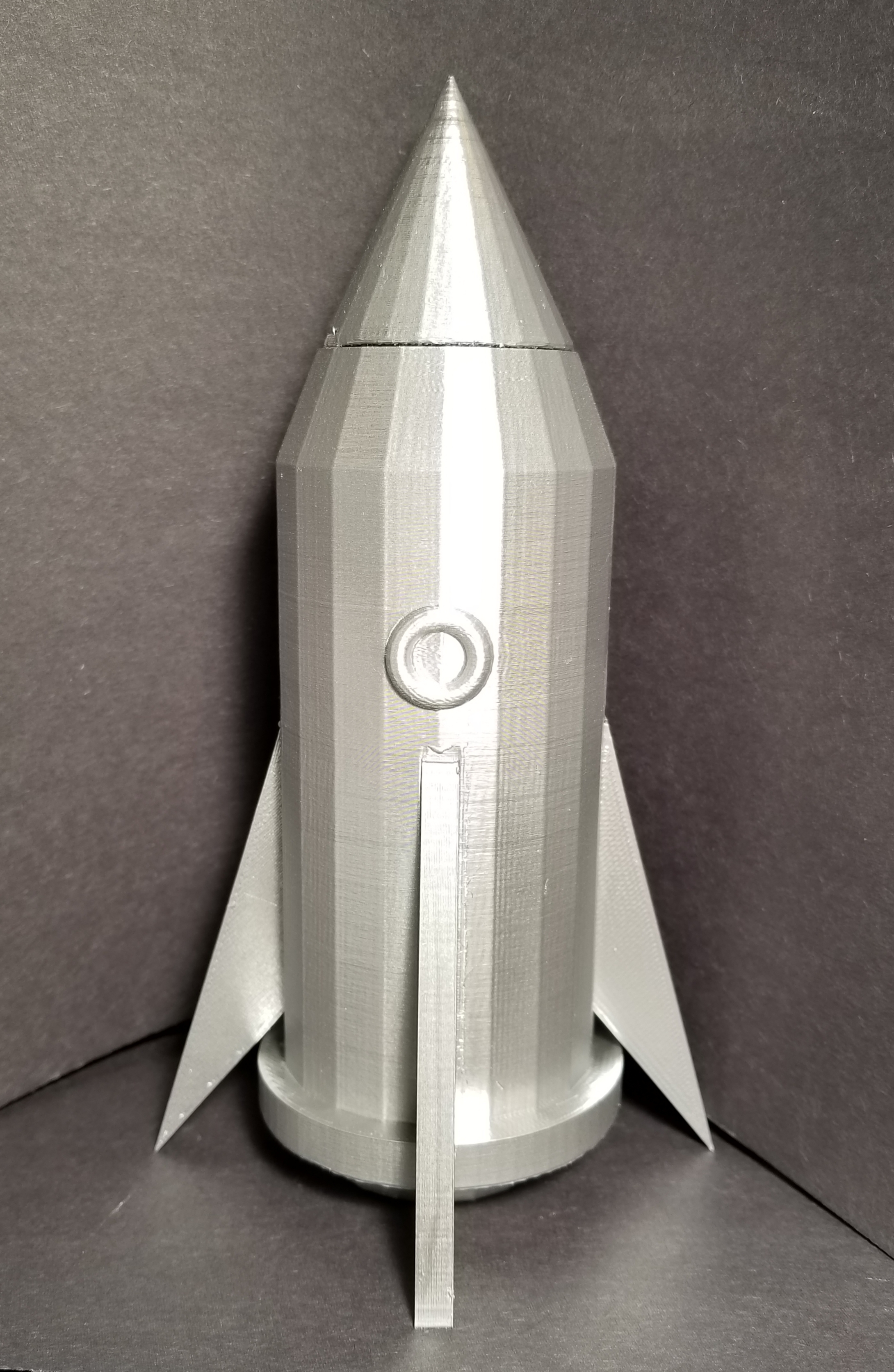 Spaceship container with interlocking lid.