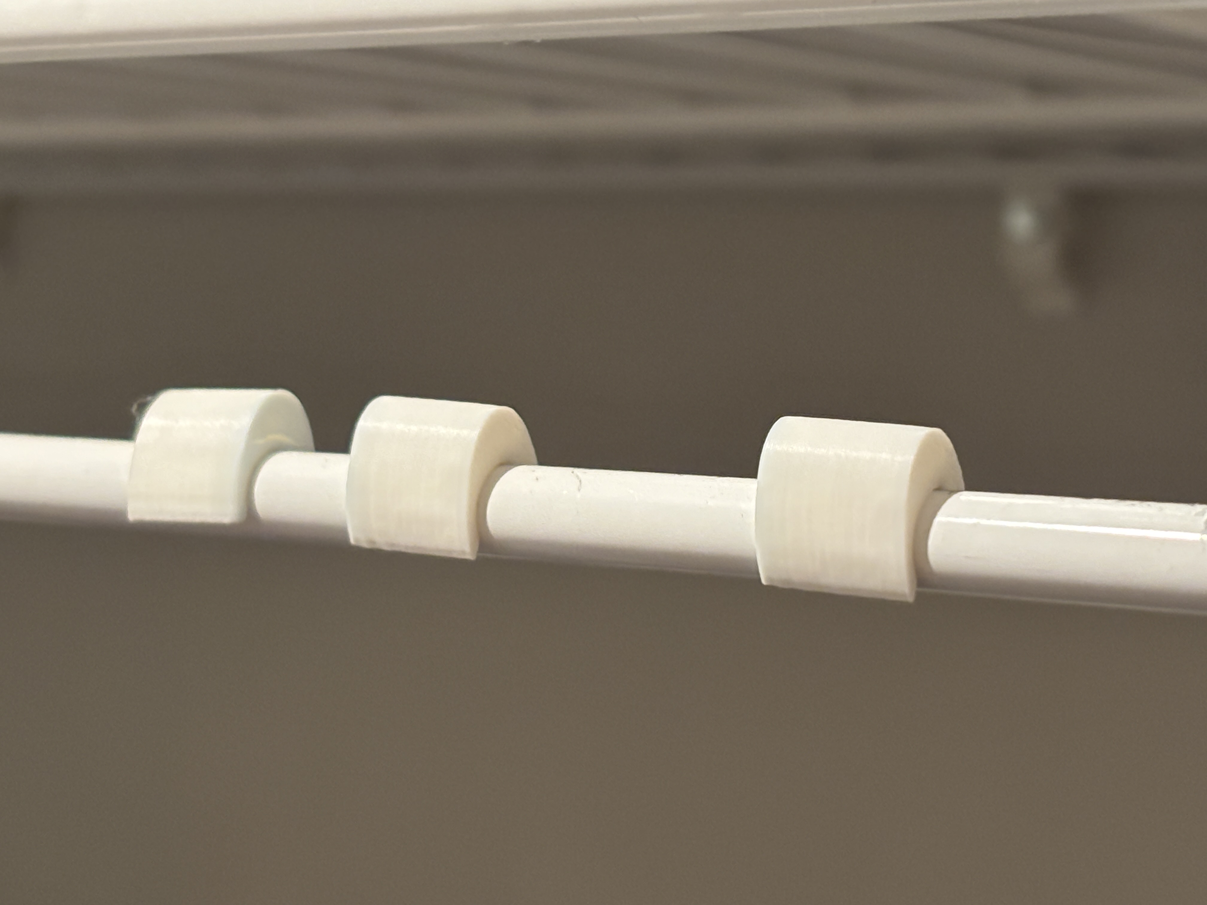 Clothes hanger separator for rubbermaid wire shelving to make the closet look more uniform