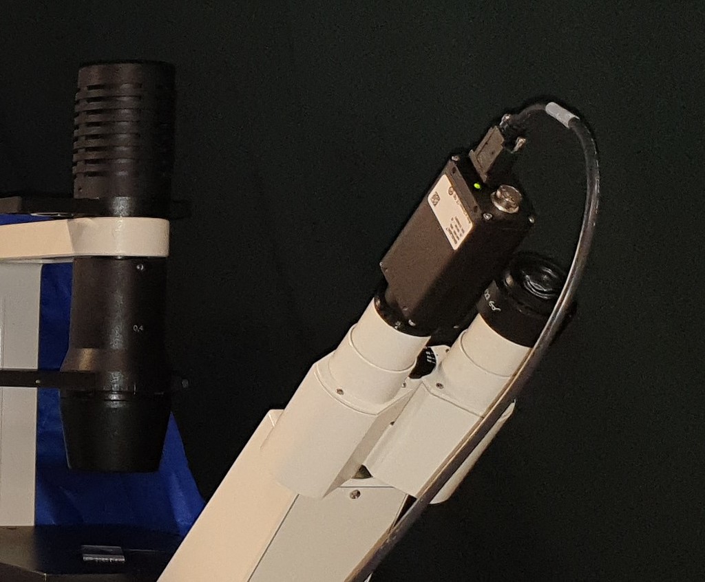 Microscope eyepiece to camera adapter with cap