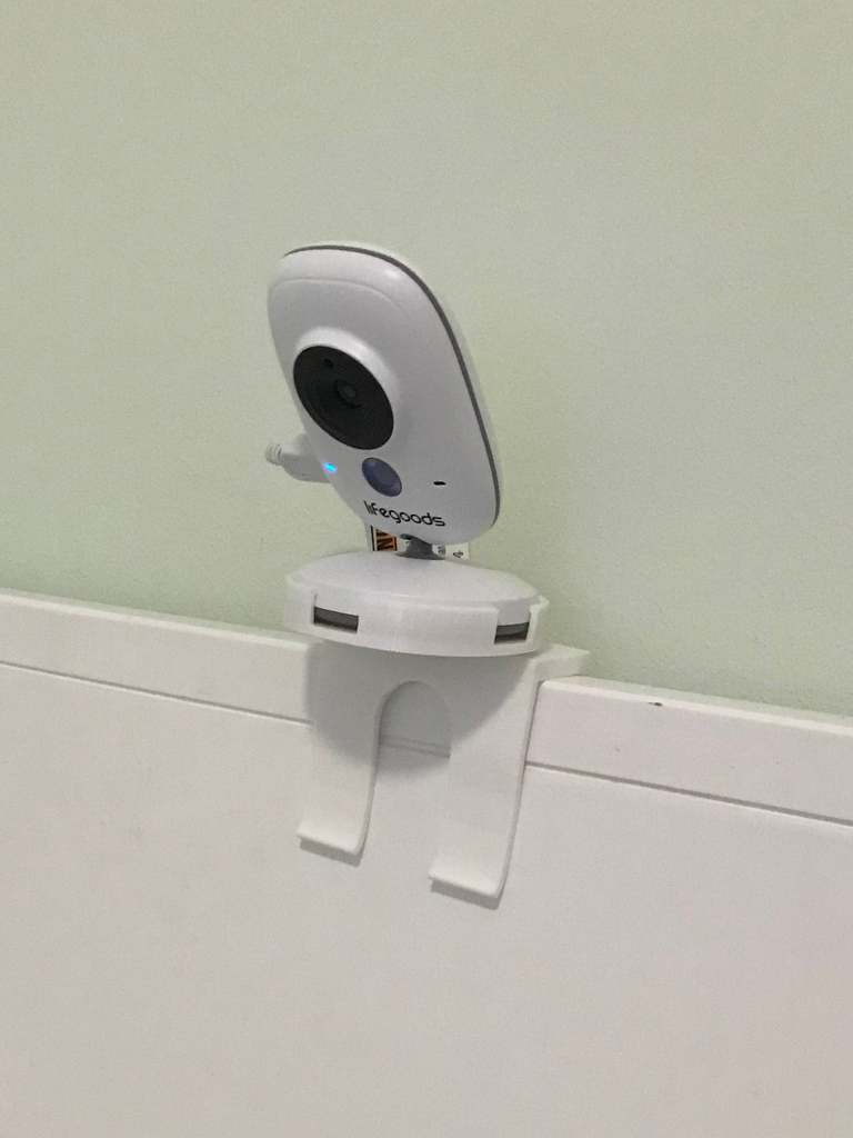 Baby monitor camera mount with off-center hole