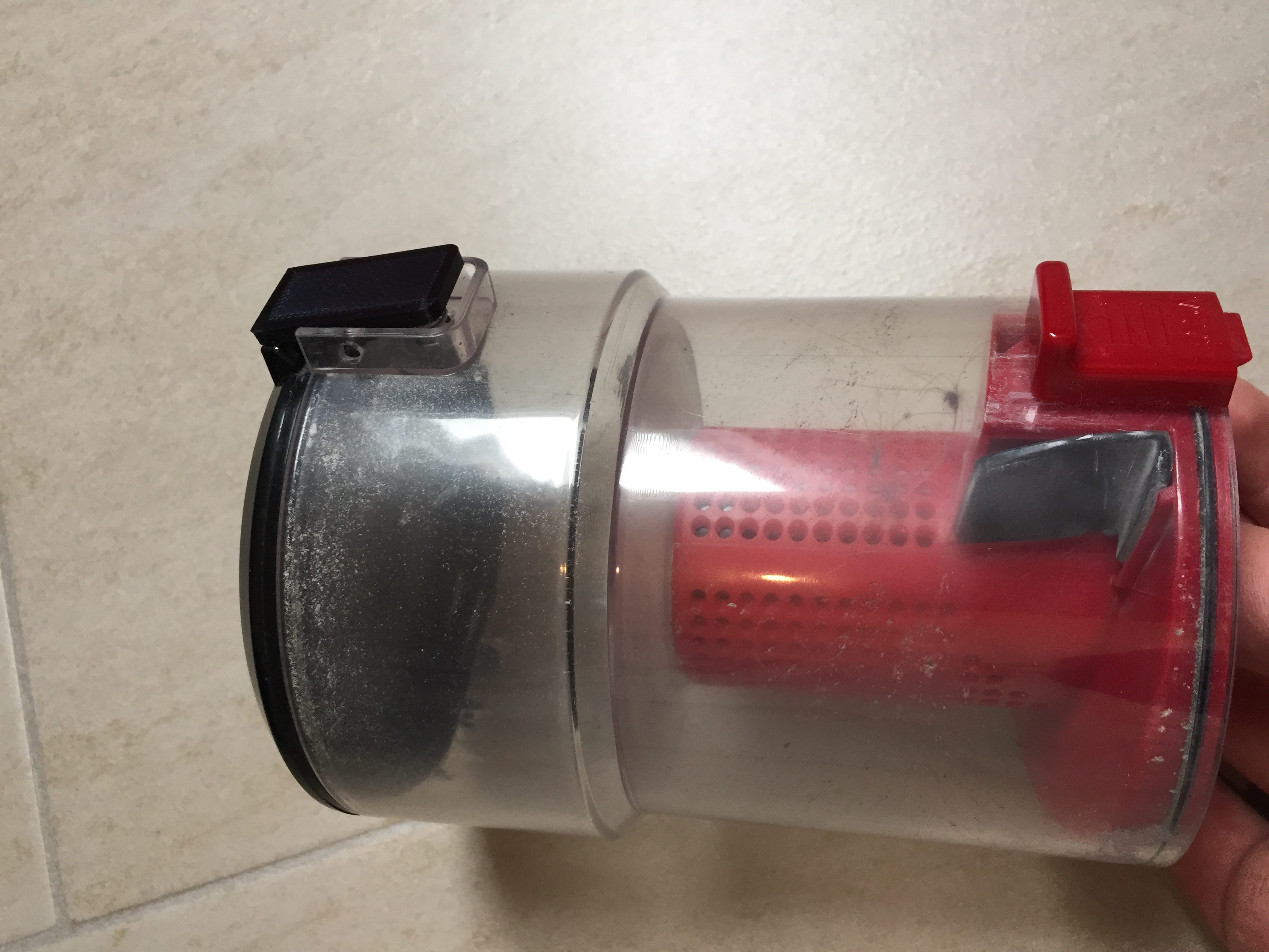 Vacuum cleaner container push button