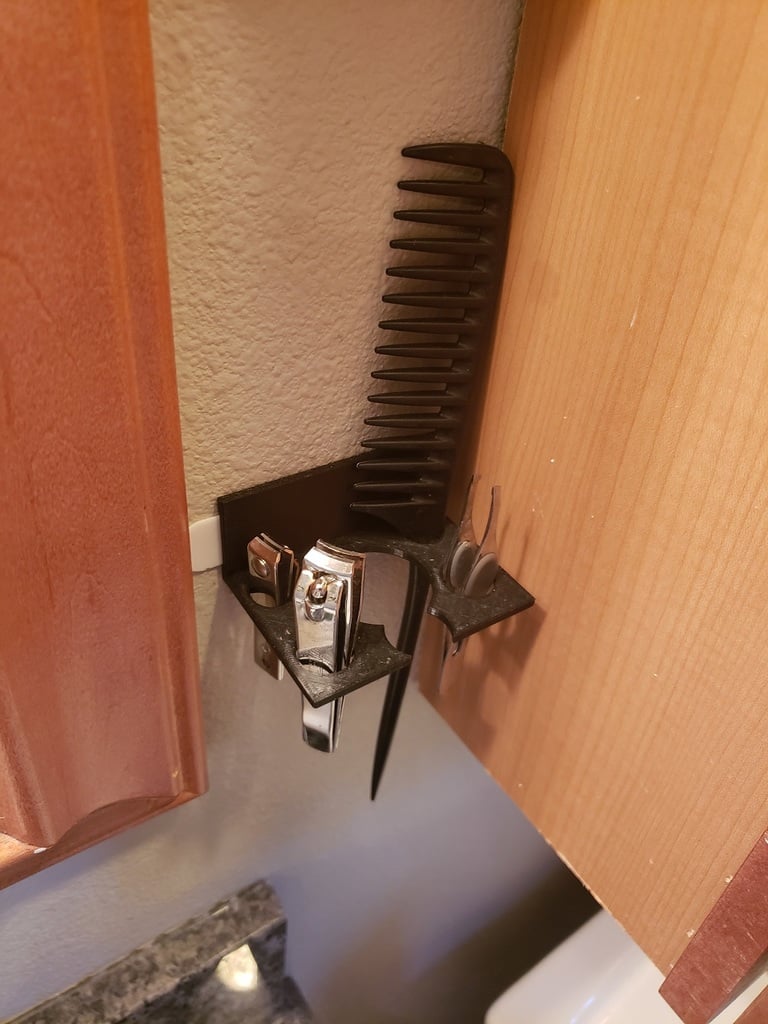 Hairbrush and accessory holder for the bathroom using a command strip