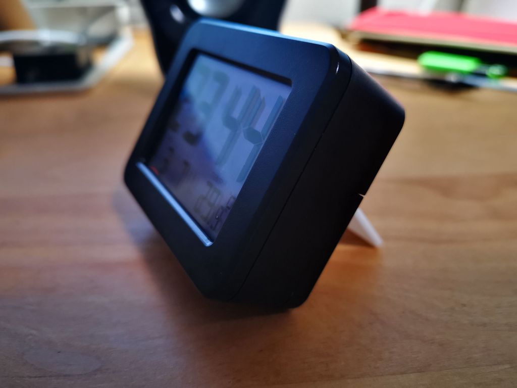 A stand at an angle to support a digital clock from DAISO