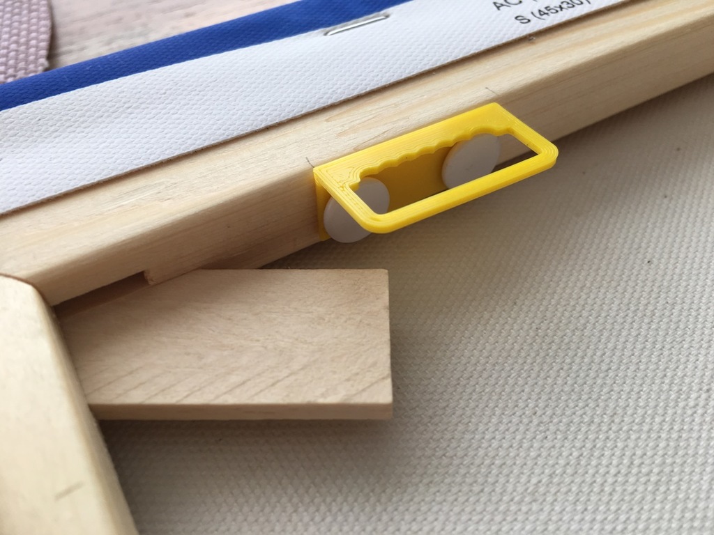 Picture frame hanger for wooden frames (use pins to fix)